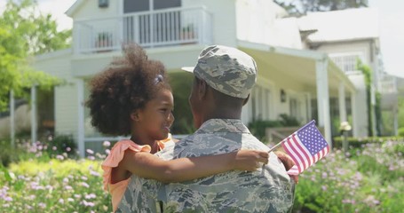 Soldier with his daughter - Powered by Adobe