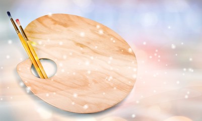 Wooden art palette with blobs of paint