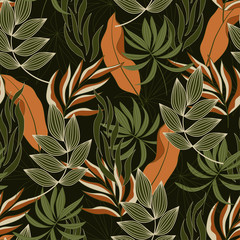 Summer seamless tropical pattern with bright orange and green leaves and plants on a black background. Colorful stylish floral. Tropical botanical. Beautiful print with hand drawn exotic plants.