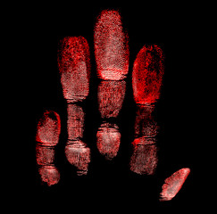 Imprints of the left hand on a black background, red color.