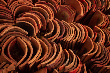 A bunch of handmade orange tiles from a semiarid region