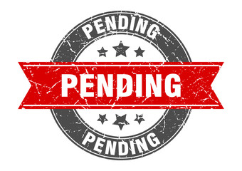 pending round stamp with red ribbon. pending