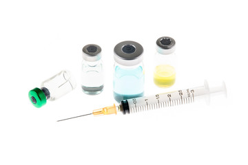 Close up of flu vaccine vial injection, medicine and drug concept