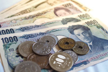 Japanese yen notes and Japanese yen coins for money concept background