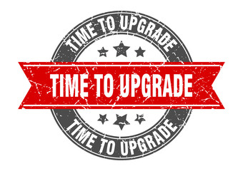 Obraz premium time to upgrade round stamp with red ribbon. time to upgrade