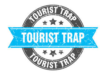 tourist trap round stamp with turquoise ribbon. tourist trap