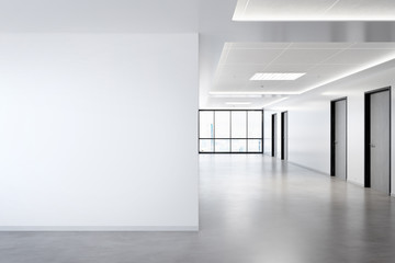 Blank wall in office mockup with large windows and sun passing through 3D rendering
