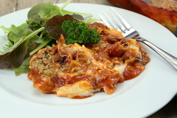 plate of moussaka and salad