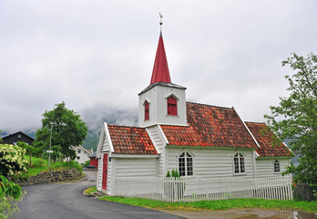 Fototapeta na wymiar Traditional white wooden church in Undredal village
