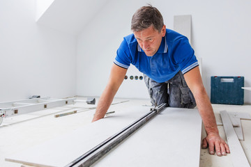 Tiler at work, house remodeling or renovation