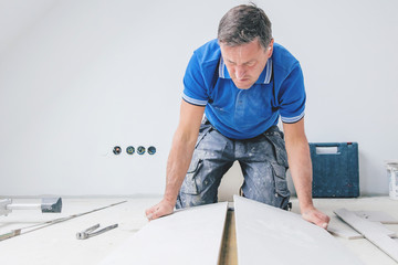 Tiler at work, house remodeling or renovation