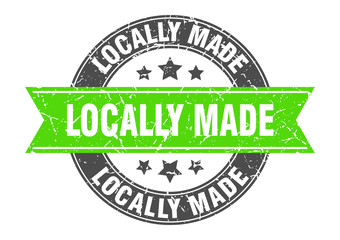 locally made round stamp with green ribbon. locally made