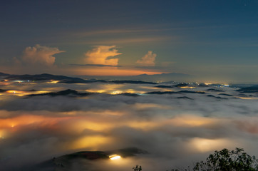 beautiful long exposure landscape of the fog city at midnight with dramatic streets light and...