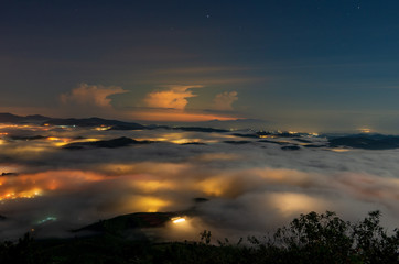 beautiful long exposure landscape of the fog city at midnight with dramatic streets light and...