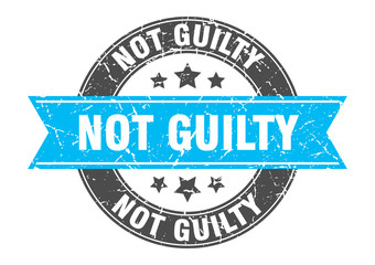not guilty round stamp with turquoise ribbon. not guilty