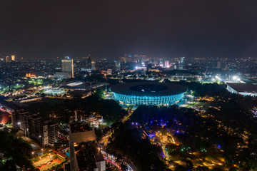 Jakarta cityscape with sport stadium at dusk