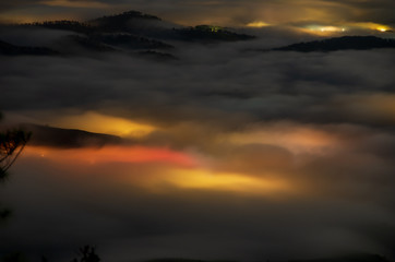 beautiful long exposure landscape of the fog city at midnight with dramatic streets light and...