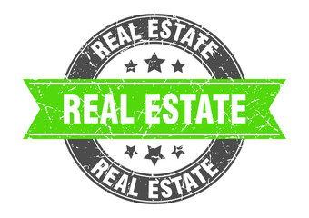 real estate round stamp with green ribbon. real estate
