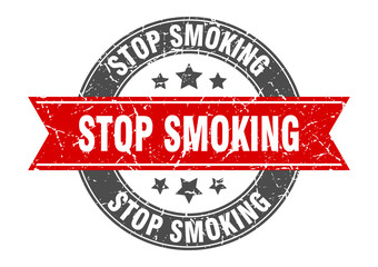 stop smoking round stamp with red ribbon. stop smoking