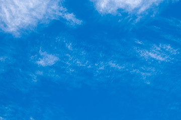 Light cirrus clouds against the blue sky.