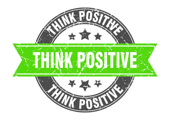 Fototapeta premium think positive round stamp with green ribbon. think positive