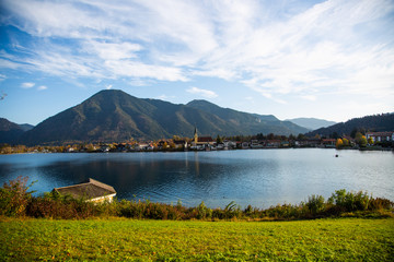 Tegernsee in autumn, with mountains in the background, church..