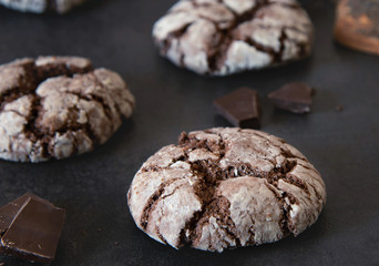 Chocolate Crinkles. Chocolate cookies in powdered sugar on a dark background