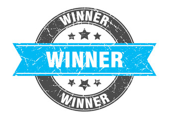 winner round stamp with turquoise ribbon. winner