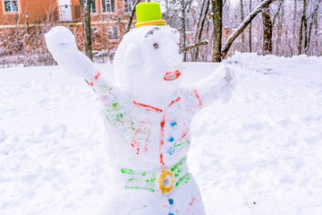 funny snowman in a city park