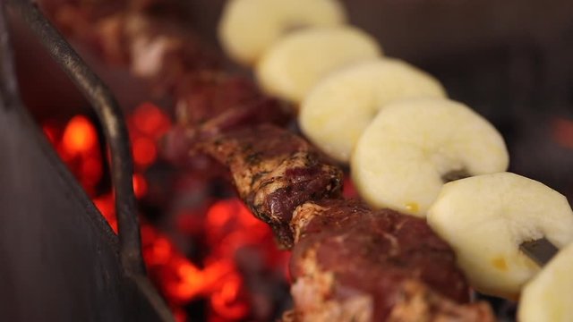 Barbecue and Potato on skewer. Slow Motion
