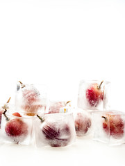 Grape inside ice on white background