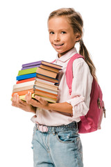 smiling schoolkid holding colorful books isolated on white