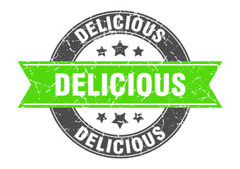 Obraz premium delicious round stamp with green ribbon. delicious