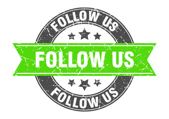 follow us round stamp with green ribbon. follow us