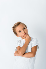 pensive kid touching face on white