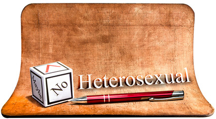 Heterosexual - NO. White paper cube with pen. The concept of the checklist.