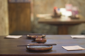 Set of empty dish on table in asian restaurant.