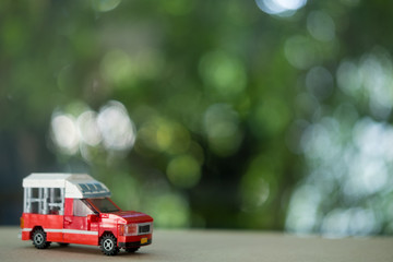 Miniature toy of red mini Truck Taxi at Chiang Mai Thailand.
