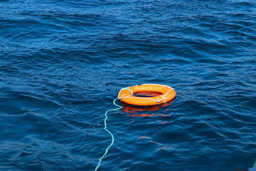 Lifebuoy on the waves in the sea