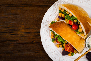 Garbanzo Bean or Chickpea Salad Veggie Pitas. Selective focus.