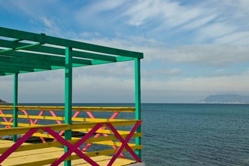 panorama of the Black Sea through a multi-colored fence