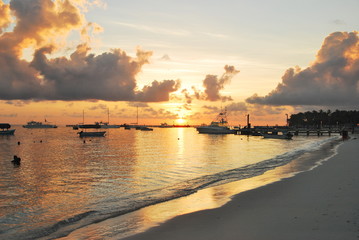 sea sunset. Palm tree sandy beach sunrise. sunset on the sandy tropical beach of Dominican. Fishing...