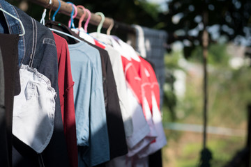 Clothes hanging on clothesline for drying after laundry.