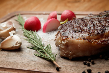 steak from beef, steak with vegetables, proper nutrition, healthy food,  a piece of boiled pork on a wooden board, presentation and serving, rustic style, vegetables for meat, 