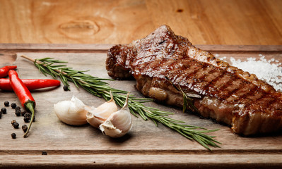 steak from beef, steak with vegetables, proper nutrition, healthy food,  a piece of boiled pork on a wooden board, presentation and serving, rustic style, vegetables for meat, 
