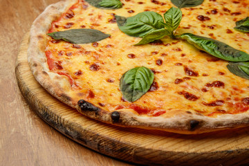 pizza with basil, Italian dish, pizzeria, presentation and serving, menu, beautifully decorated dish, delicious food, pizza, tasty and hot pizza, greens, pizza wooden board, basil