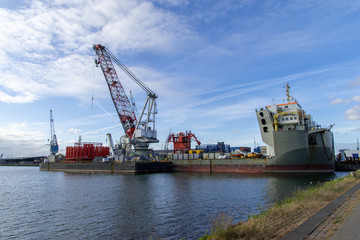Large cargo ship docked in the port of Rotterdam, the Netherlands, Europe.