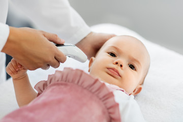 medicine, healthcare and pediatrics concept - female pediatrician doctor with digital infrared...