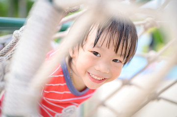 Portrait of young asian boy in playground