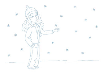 cute girl with cap and scarf catching snowflakes 